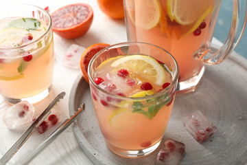 Lemonade with cranberry and lemon on wooden background. Fresh drink