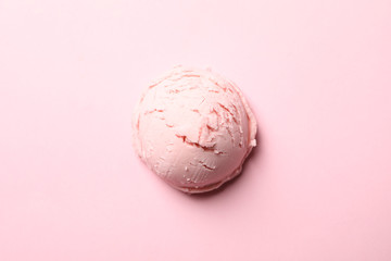 Ice cream ball on pink background, close up