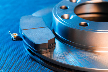 brake pads and brake disc on dark  background .