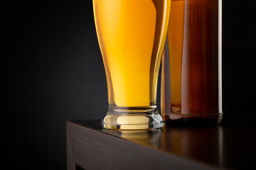 Detail of beer glass and bottle