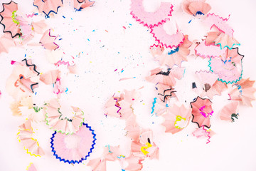 Background made of colorful pencil shavings background. Place for text.
