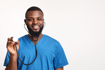 Cheerful african doctor ready to examine patient