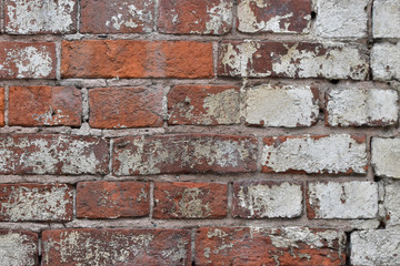 The unique texture of the limestone-covered brick wall