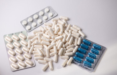 white pills with white powder close-up top view