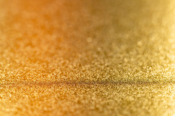 Metalic gold color, shiny reflective glitter background