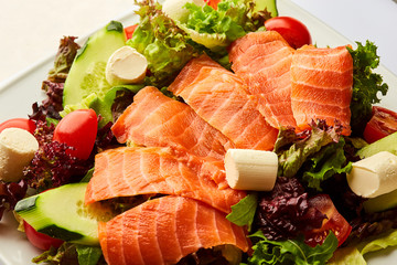 Healthy vegetable salad with smoked salmon. Buddha bowl, dieting concept