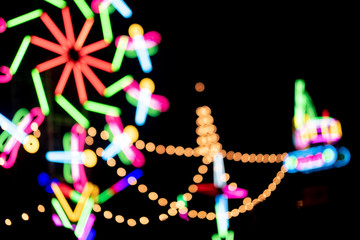 Blur colors light beam of fluorescent light colorful in festival temple fair night background