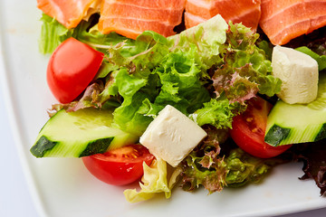 Healthy vegetable salad with smoked salmon. Buddha bowl, dieting concept