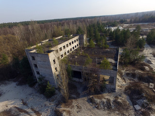 Fototapeta na wymiar Drone quadrocopter explores an abandoned industrial complex.Kiev Region