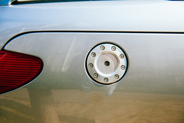 Close-up detail of new silver sport car with gas-tank door