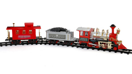 Toy train on tracks isolated on white background