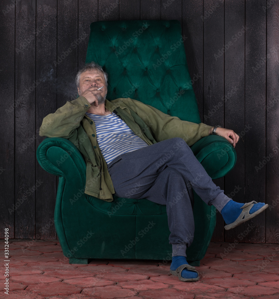 Sticker man with a cigarette sitting on an armchair