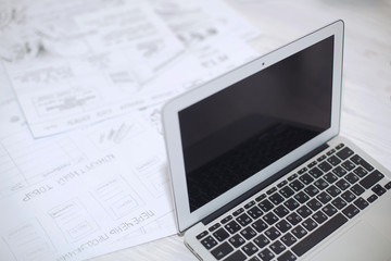 white laptop  in office  on the desk with work records. Laptop computer with blank screen in office on white background. blank study place with open laptop. work and study remotely at home. be online