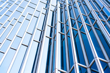 underside panoramic and perspective view to steel blue glass high rise building skyscrapers, business concept of successful industrial architecture