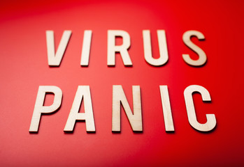 virus panic word text wooden letter on red background coronavirus covid-19