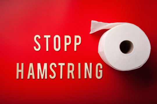 stopp hamstring norwegian word toilet paper text wooden letter on red background coronavirus covid-19