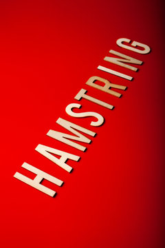 hamstring norwegian word text wooden letter on red background coronavirus covid-19