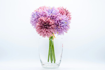 Purple Fabric flower bouquet in a glass pot White background and isolated