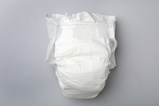 Baby diaper on light grey background, top view