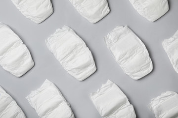 Flat lay composition with diapers on light grey background