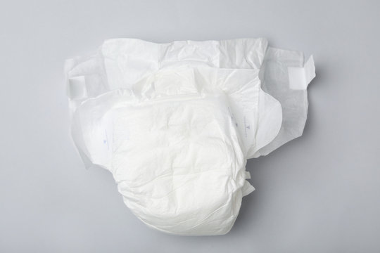 Baby diaper on light grey background, top view