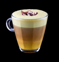 Hot coffee drinks on a black background. Latte with milk and colorful additives