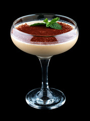Exquisite cocktail with cream and chocolate. On dark background