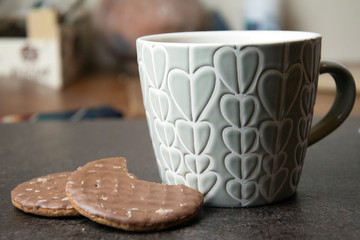 Fototapeta na wymiar Close up of warm coffee and chocolate biscuit