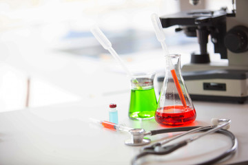 The doctor is testing a sample of biological tubes contaminated by Corona-virus Covid 19 and searching for a vaccine or Syrup against the virus. In the laboratory and film samples of infected lung