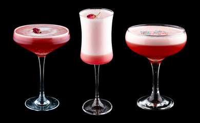 Exquisite original cocktails on a black background. Strawberries, rose petals, cherry syrup.