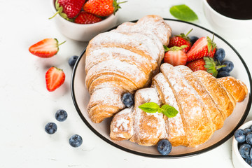 Croissant with chocolate and fresh berries.