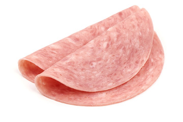 Thin salami sausage slices, isolated on white background