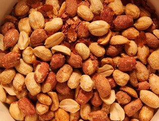 a picture of salty and tasty brown yellow peanuts
