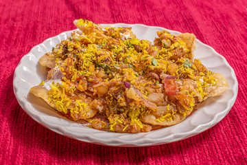 Papdi chaat, a popular street food in India, served on a plate. Selective focus