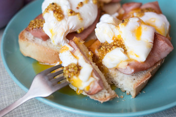 healthy breakfast. Toast with egg poached, sausages, cheese and French mustard  Avocado sandwich on...