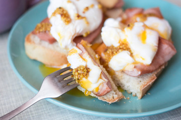 healthy breakfast. Toast with egg poached, sausages, cheese and French mustard  Avocado sandwich on...