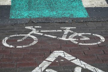 Bicycle parking sign painted on paint on asphalt
