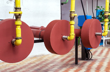 Gas burners on a hot water boiler in a gas boiler house. Gas boiler house equipment. .