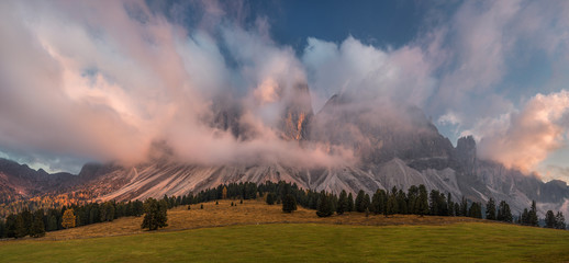 The Dolomites Geisler Odle mountain peaks covered by clouds. Scenic landscape. South Tyrol, Northern Italy