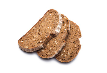 three pieces of black bread with sunflower seeds on a white background