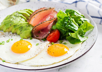 Ketogenic/paleo diet. Fried eggs, ham, avocado and fresh salad.  Keto breakfast. Brunch.