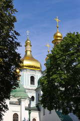 Fototapeta na wymiar View of the Cathedral, Sofia Kyiv is a landmark of history and architecture. sunny day . Gold domes, orthodox crosses. UNESCO World Heritage Site St. Sophia Cathedral in Kyiv, the capital of Ukraine.