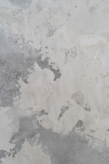 grey wall with rough plaster. the rough surface.