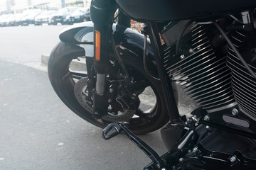Fototapeta na wymiar front of the motorcycle, wheel, disc brakes closeup