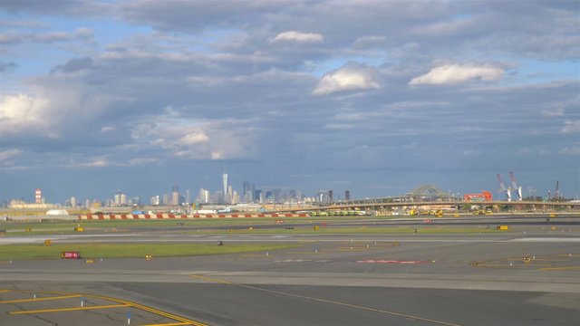 Runway Airplane in Newark New York Airport with view at Manhattan in 4K Slow motion 60fps