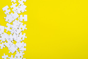 Jigsaw puzzles on the yellow background
