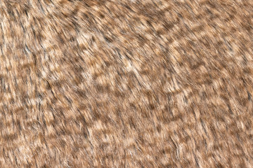Brown real wool with a dark top texture background, orange natural wool,  fluffy fur texture for designers, close-up  wool rug