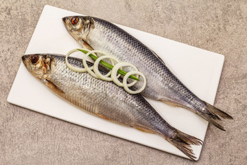 Pickled whole herrings. Traditional seafood delicacy, healthy eating concept