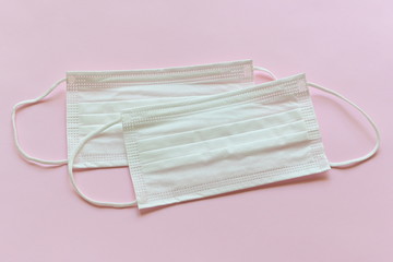 medical hygiene face mask on pink background