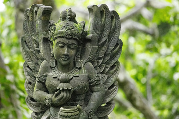 Fototapeta na wymiar Stutue in Sacred Monkey Forest, Ubud, Bali, Indonesia